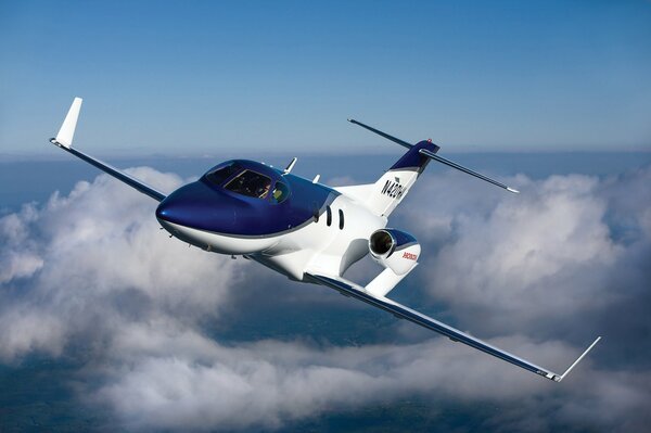 Japanese business jet over the clouds