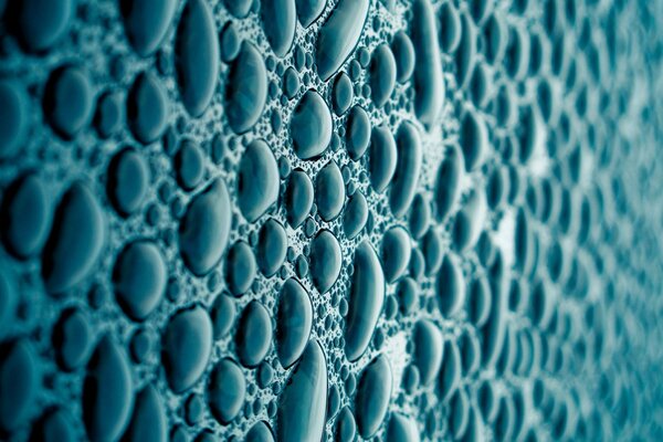 Macro texture of drops on a blue background