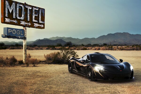 Black mclaren p1 supercar in the desert
