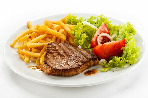 Foto di braciola con patate e verdure