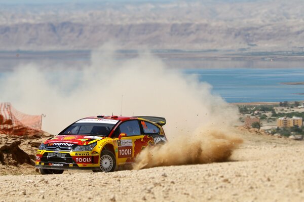 Yellow Citroen raised a column of dust during the race