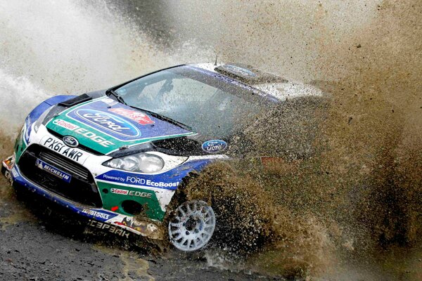 Ford rally in mud splashes