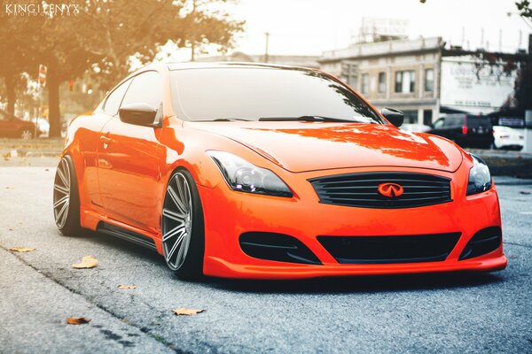 Orange tuned infiniti on the street