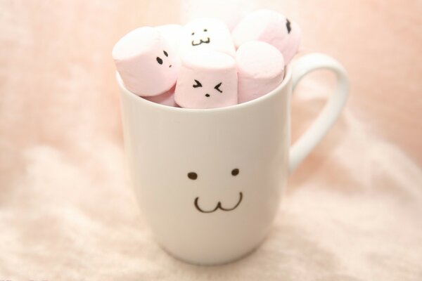 Mug with a cute face and marshmallows