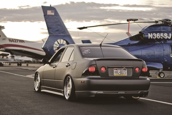 Lexus car on the background of a helicopter
