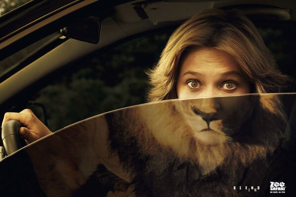 A woman and a lion in one person in a car