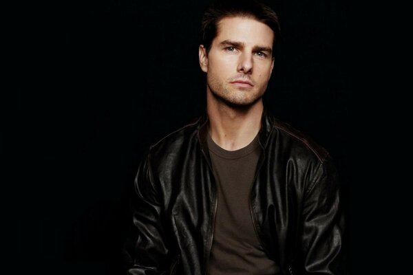 Actor Tom Cruise on a black background