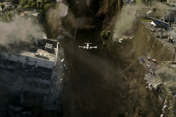 Flugzeug vor dem Hintergrund einer zerstörten Stadt