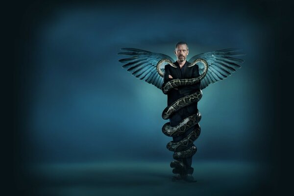 Hugh Laurie with a huge snake and wings on his back