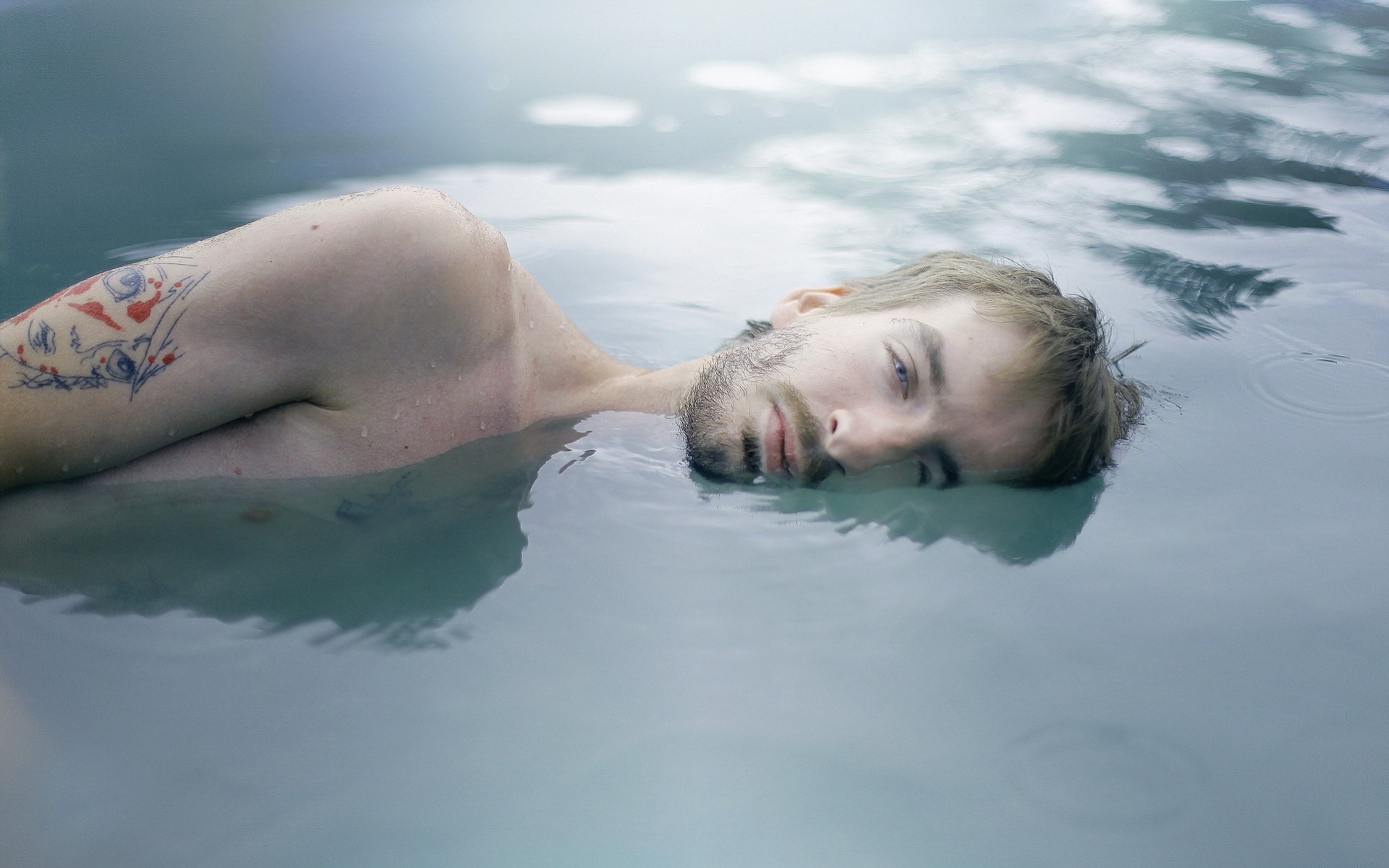 man tattoos water