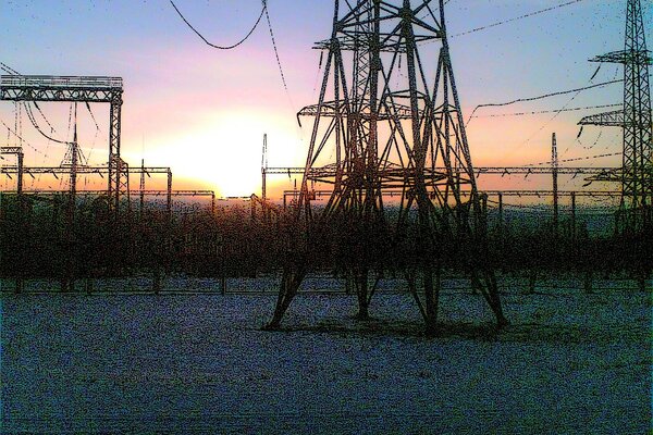 Power lines in the rays of dawn