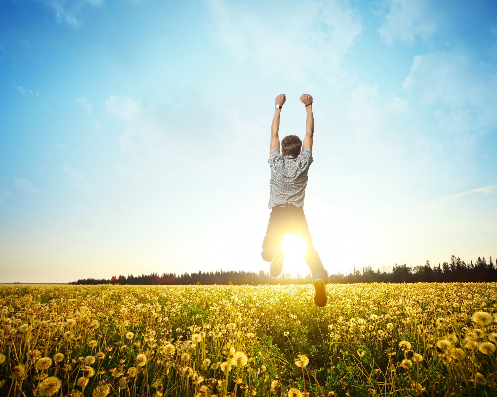 saut homme pissenlits matin soleil ciel