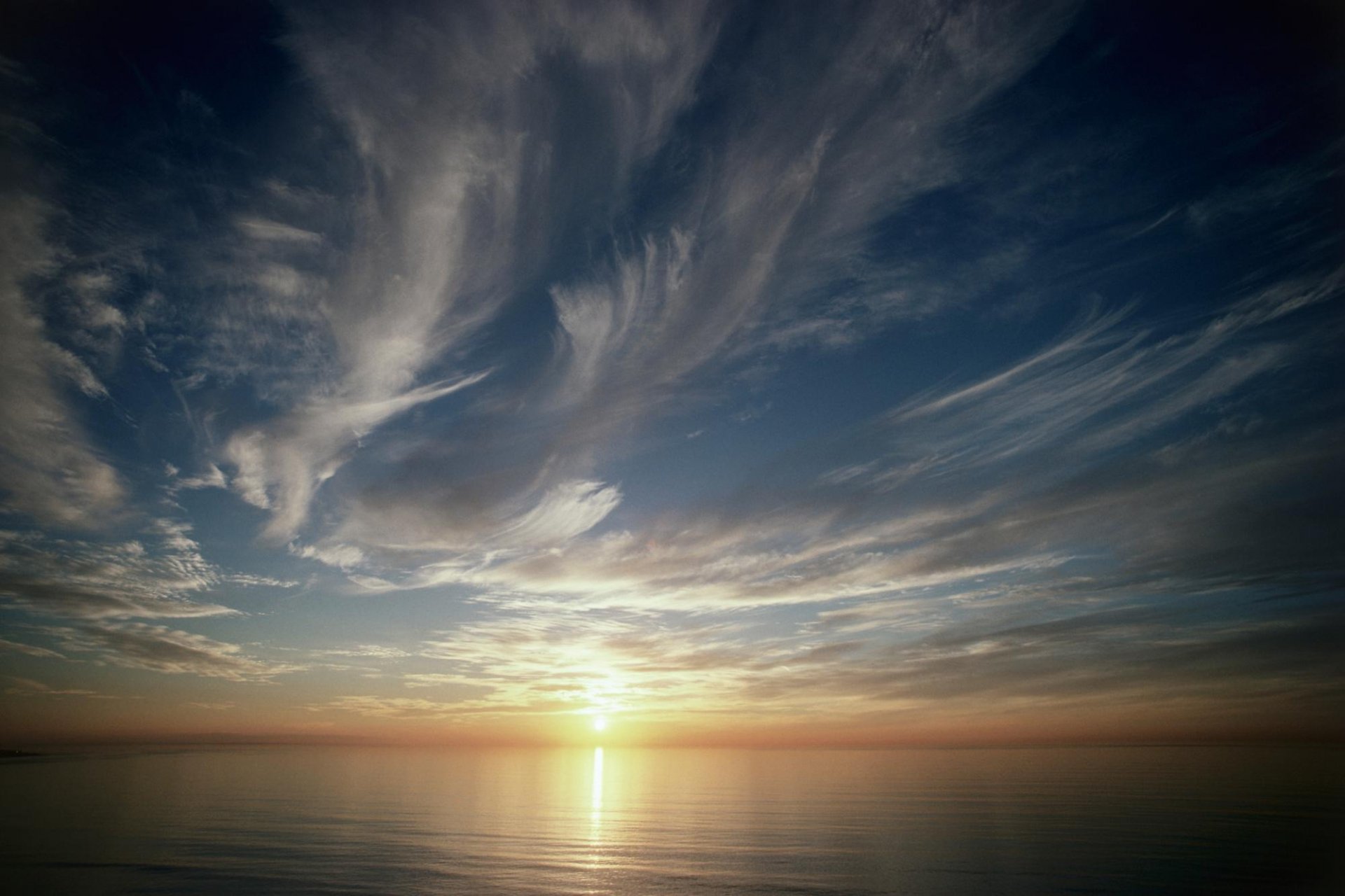 unset sky horizon clouds surface of