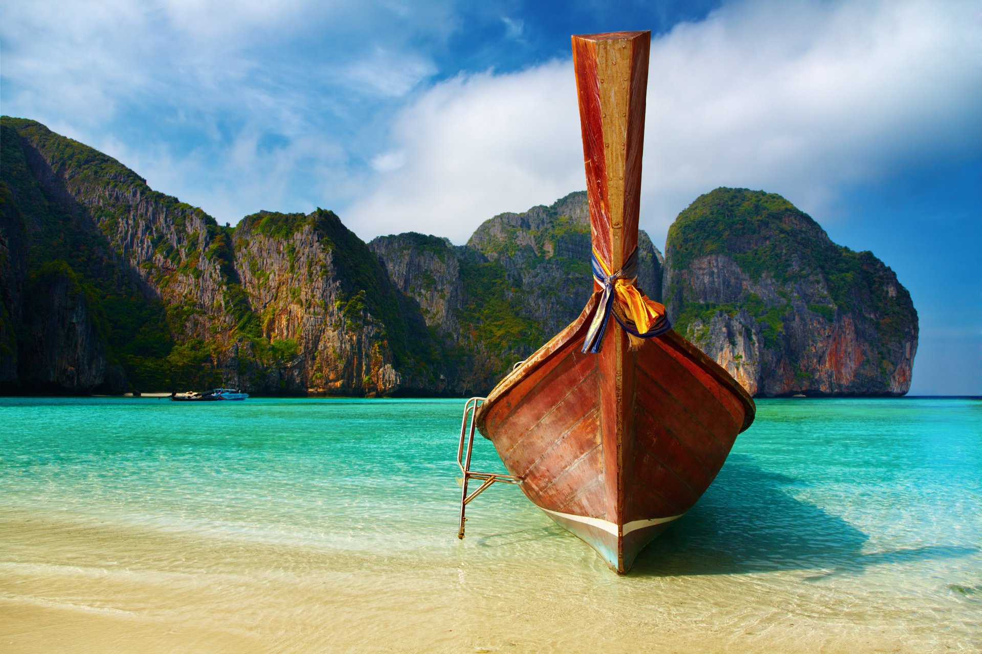 islands boat sea shore beach ocean water sky rocks photo