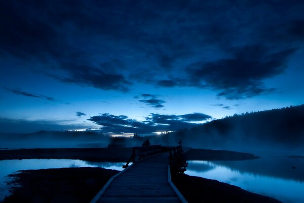 Blue at night at night. Bridge and river