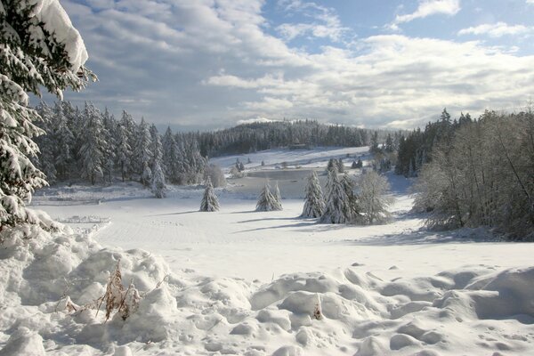 Snowy lake in winter in ice