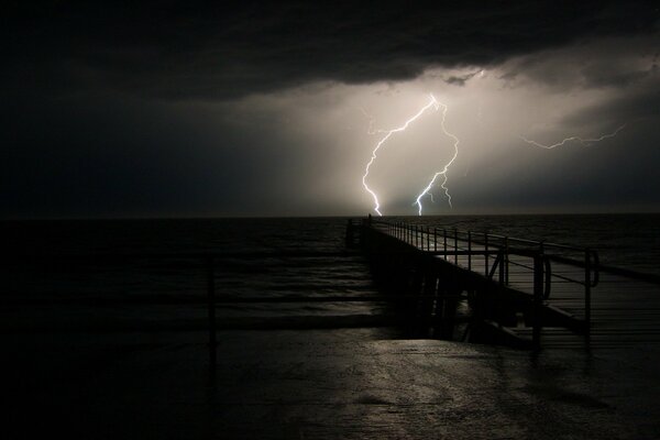 Lightning storm before the storm on the background of the ocean