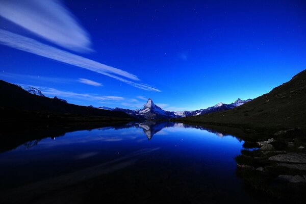 Night landscape. In the distance you can see the top of the mountain