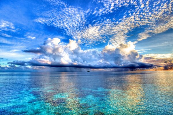 The ocean touches the clouds on the horizon