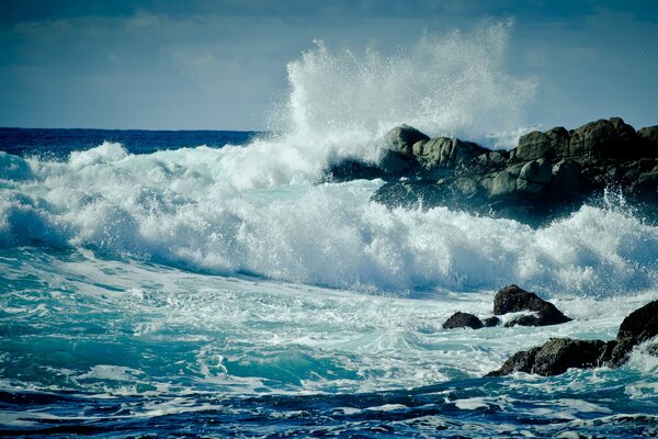 Landscape sea waves rocks splashes