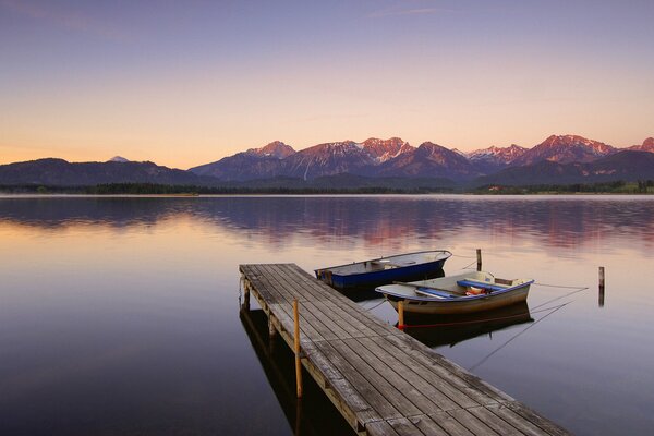 Lake at dawn. Berth and boats