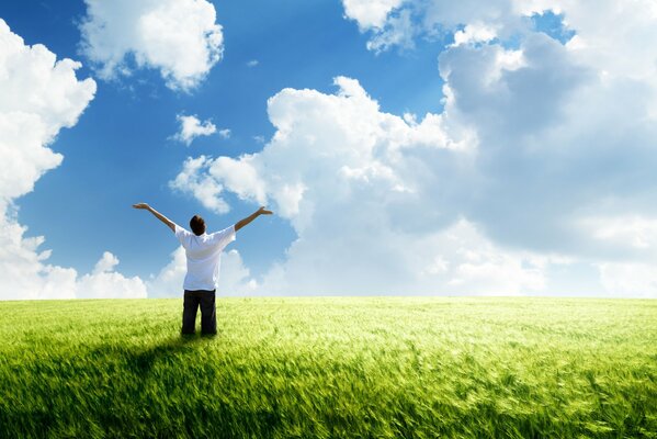 The feeling of freedom of a guy standing in a field of wheat