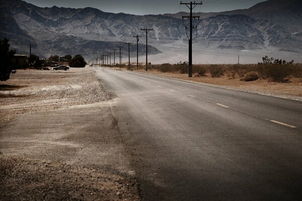 The road against the background of mountains and stacks