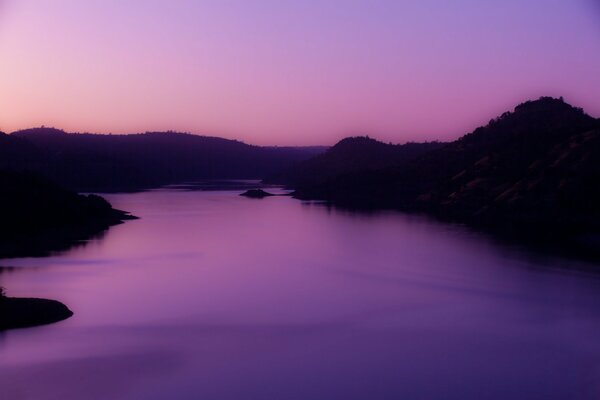 Violet sky in the evening over the river