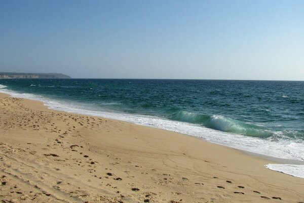 The tranquility of the ocean and the sand of the land