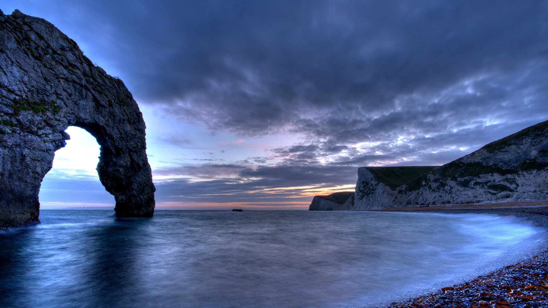 meer bucht felsen england wolken