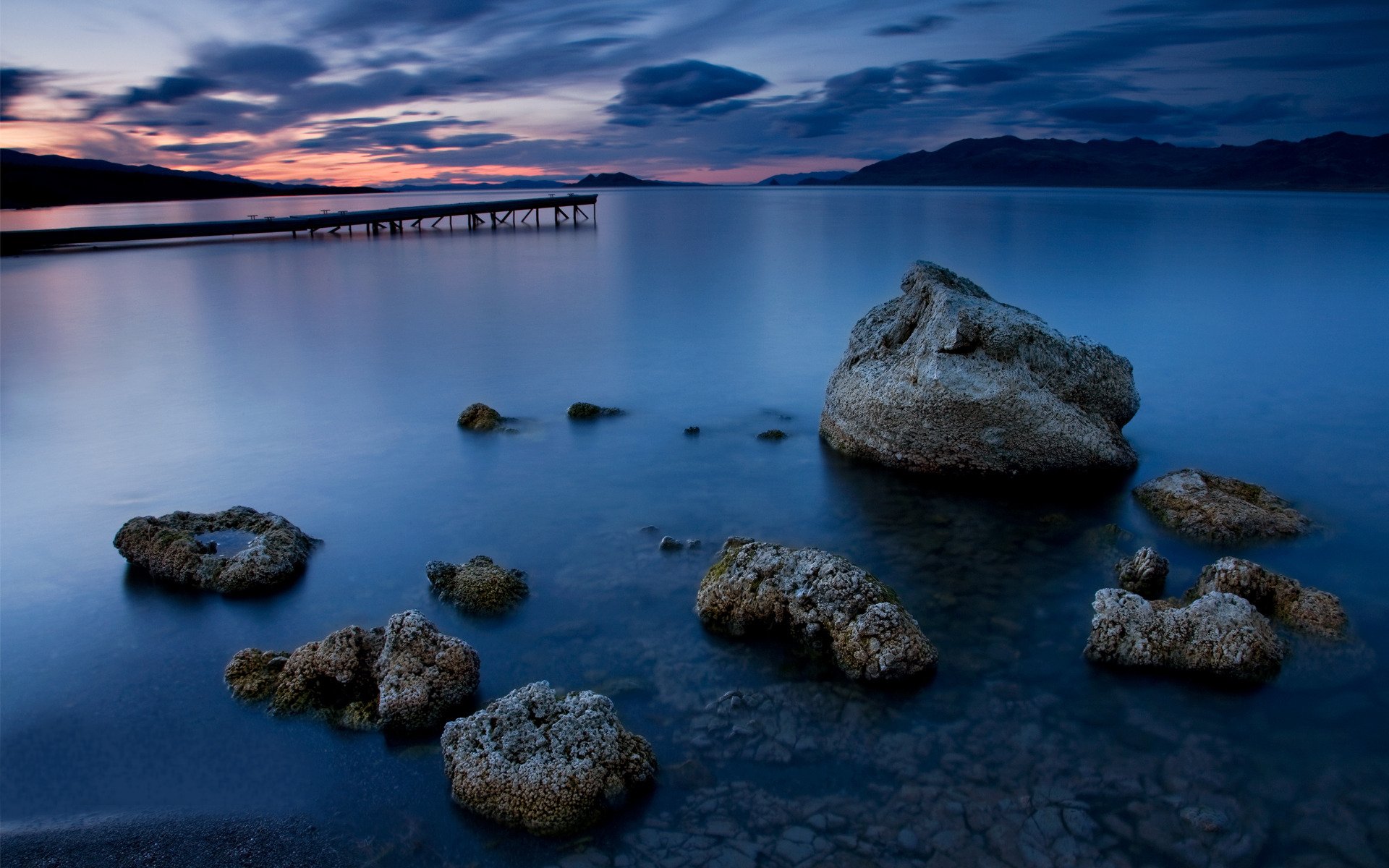 paisaje agua noche océano piedras puente nubes costa