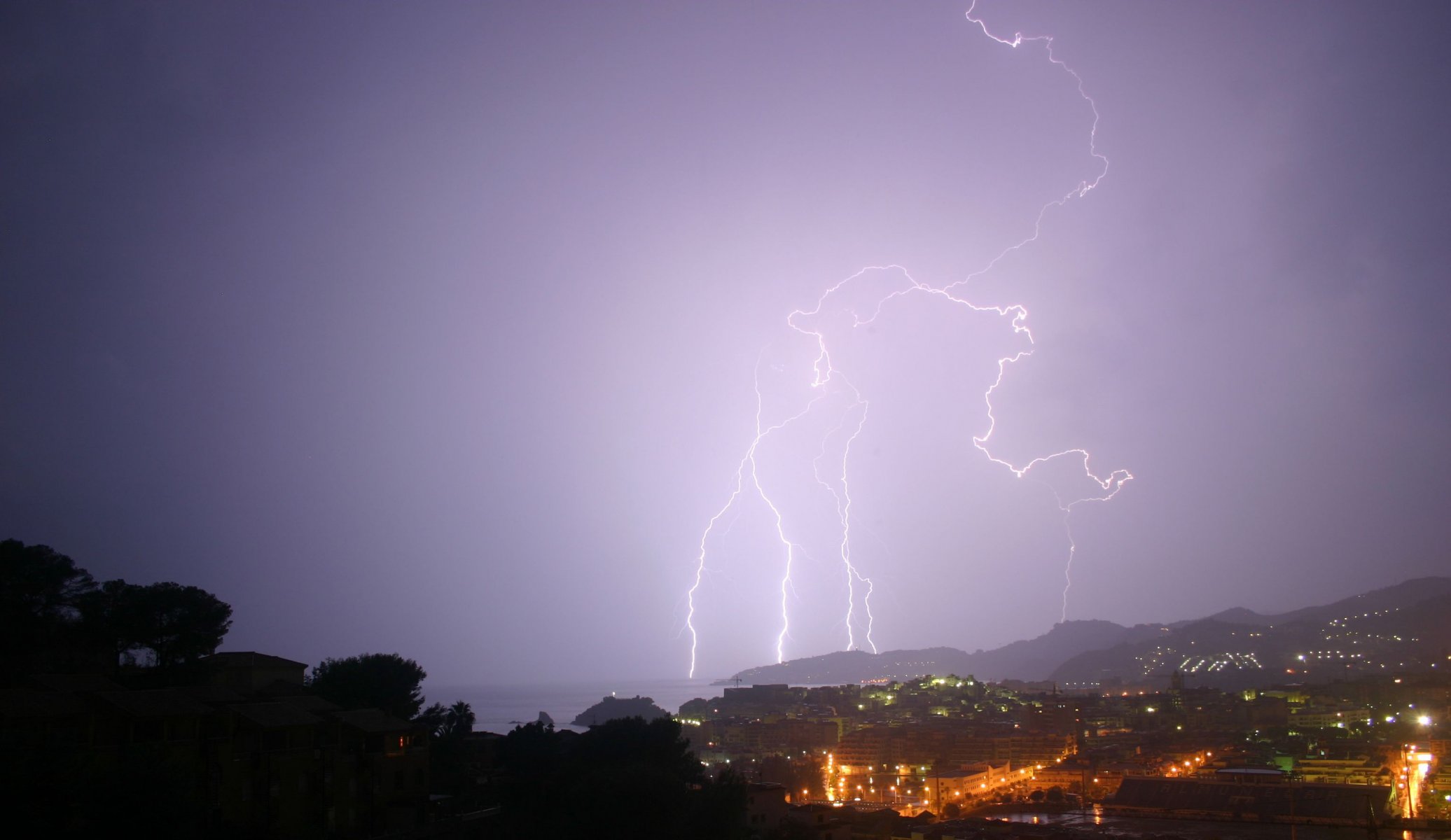 nature lightning town lights ocean