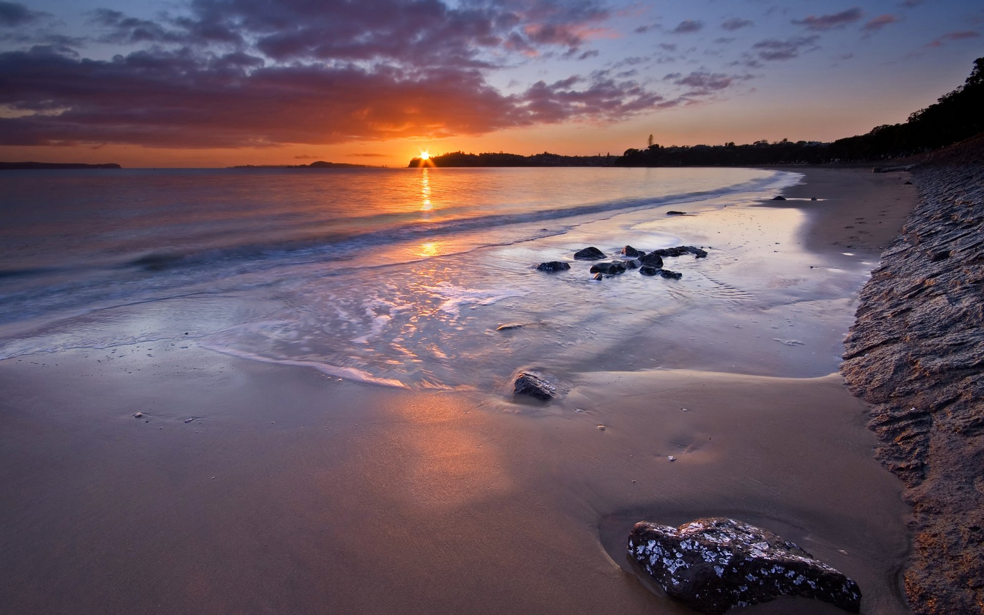 auckland nueva zelanda playa puesta de sol