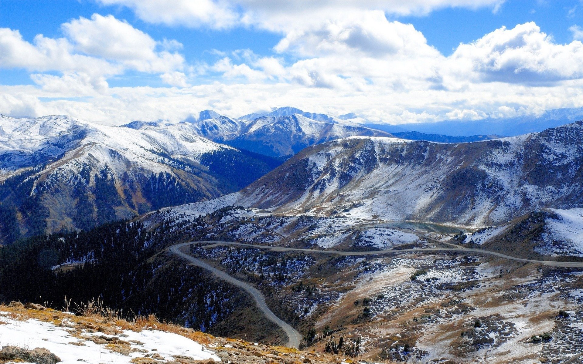 mountain road rock hills grass landscapes mountains snow roads cloud