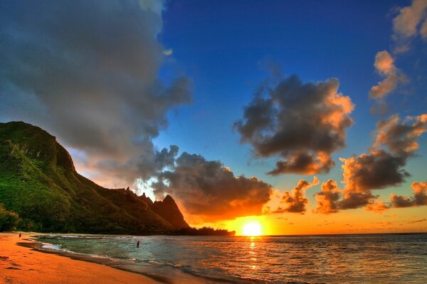 A delightful sunrise on the sea, among the mountains