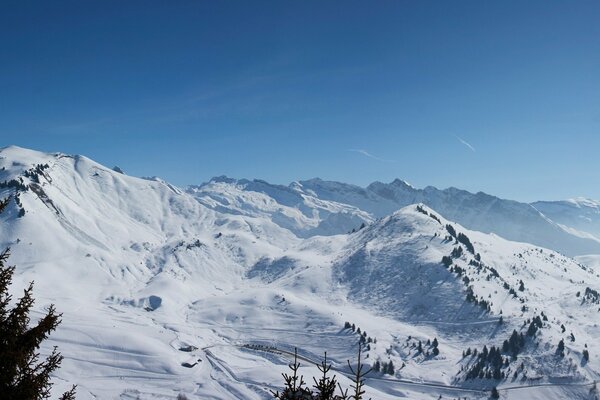 Snowy mountains against the winter sky