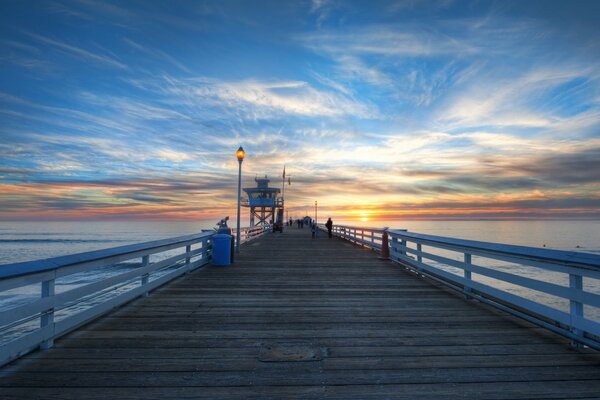 Long wooden bridge at sunset