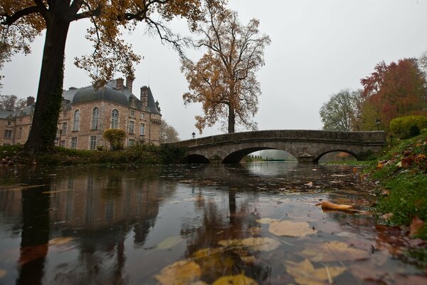 Stone bridge on a pond in an English estate