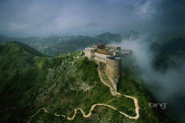 Misty castle at the top of the mountain