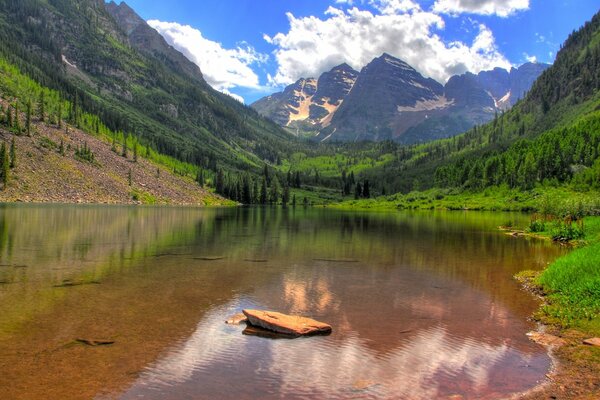 Beautiful canyon on the background of mountains, clouds and forests