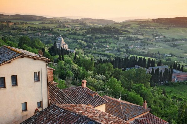 Italian houses and fields at sunset