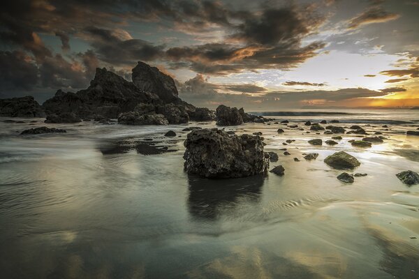 The sky is overcast over the sea