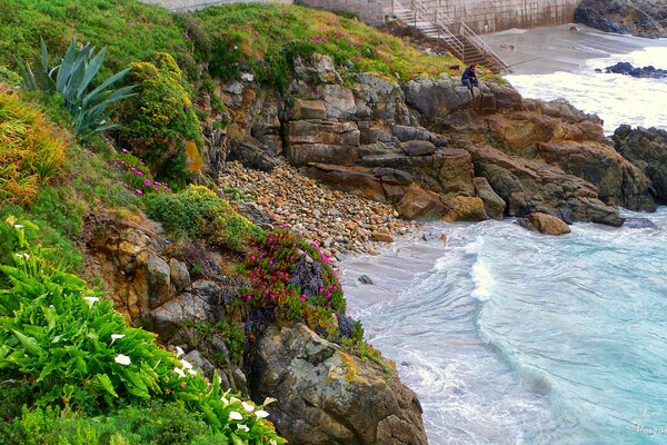 Fisherman on the shore of a beautiful bay