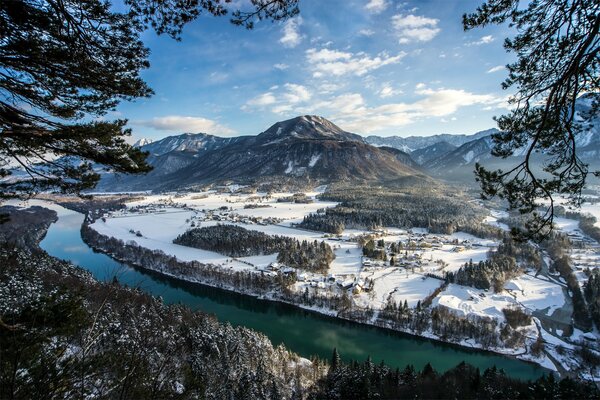 Winter river flowing along the mountains