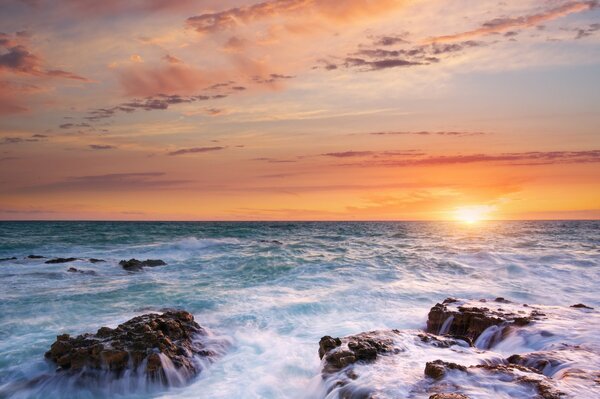 Sea sunset rocks and sky