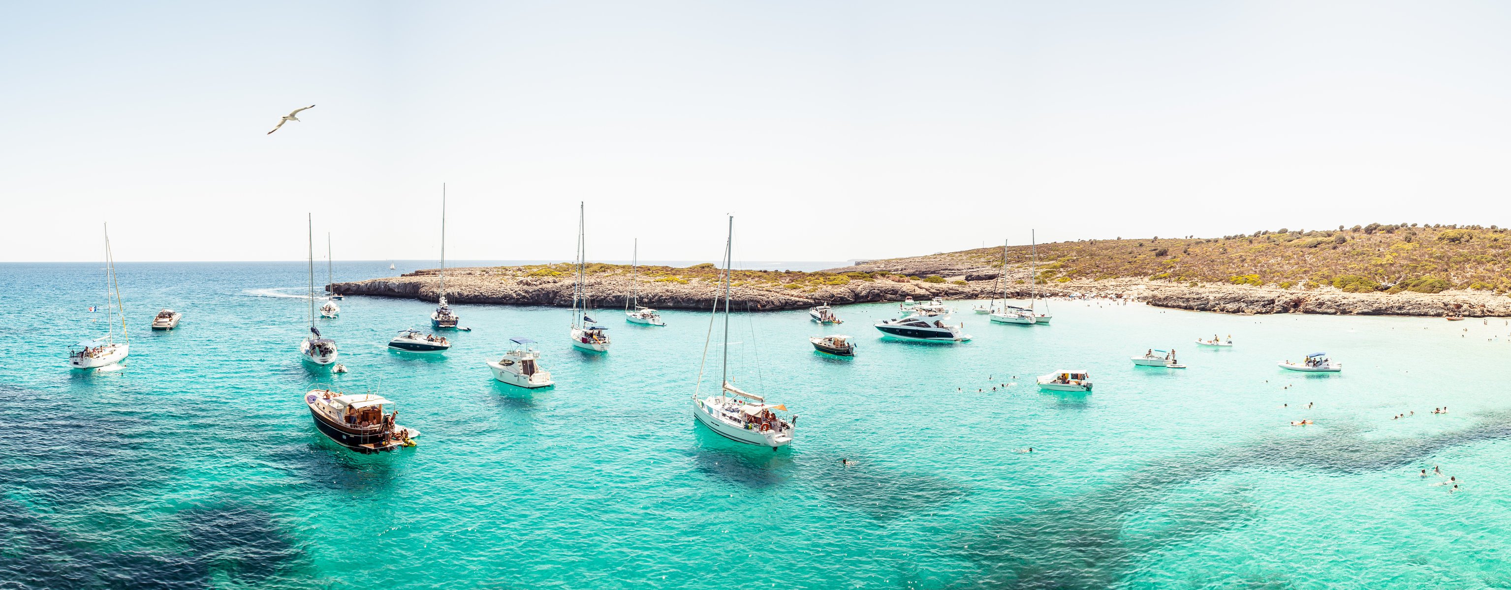 fotógrafo andrés nieto porras foto yate barco barco vela océano playa isla paraíso panorama