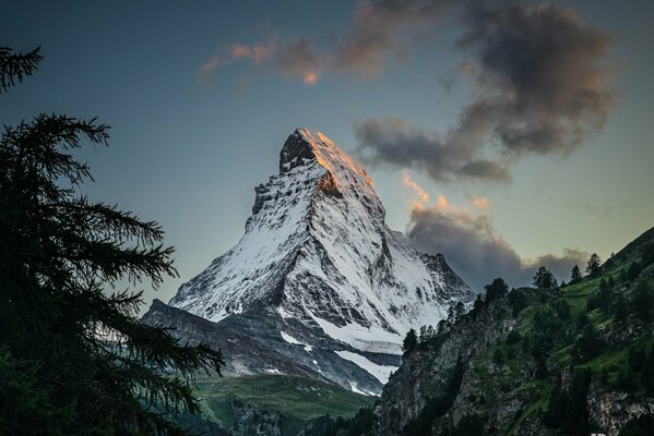 The top of the mountain rests against the sky