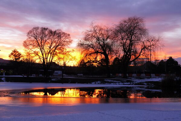 Sunset reflection in an icy lake