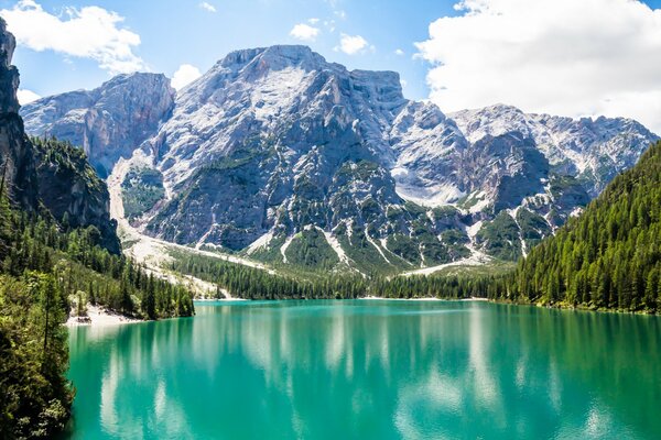 Emerald lake with a view of the snowy mountains