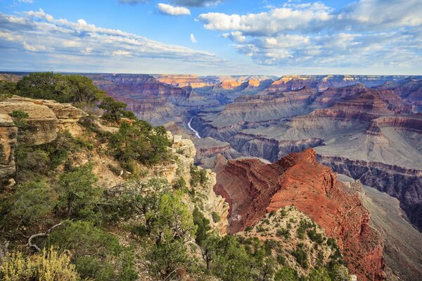 Clear blue sky over orange canyon